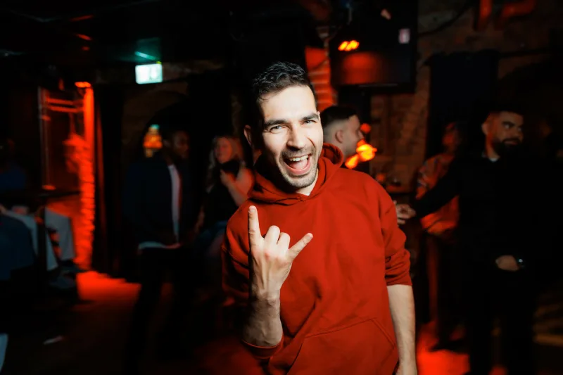 Anton Kozyr with a camera at a party