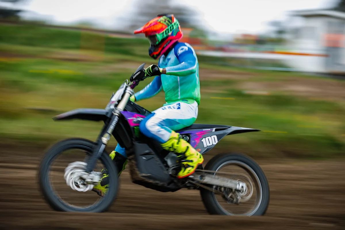 Rider in turquoise on an electric motocross bike with motion blur, Varberg